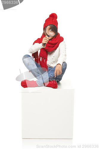 Image of Winter woman sitting on blank billboard placard sign