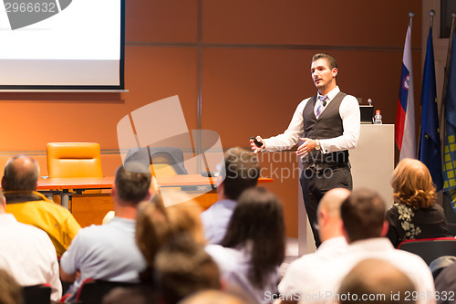 Image of Speaker at Business Conference and Presentation.