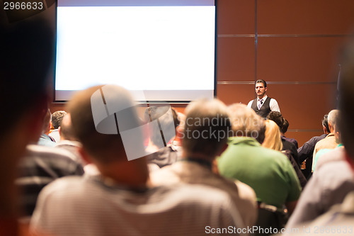 Image of Speaker at Business Conference and Presentation.