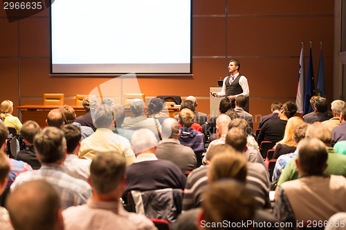 Image of Speaker at Business Conference and Presentation.