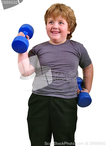 Image of isolated portrait of smiling kid exercising with dumbbells 