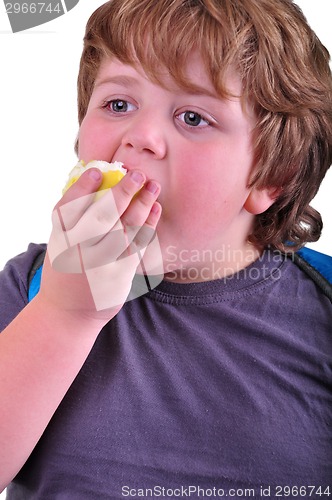 Image of closeup portrait of kid eating an apple
