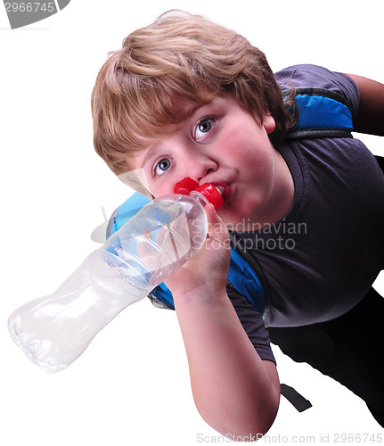 Image of closeup portrait of kid drinking water