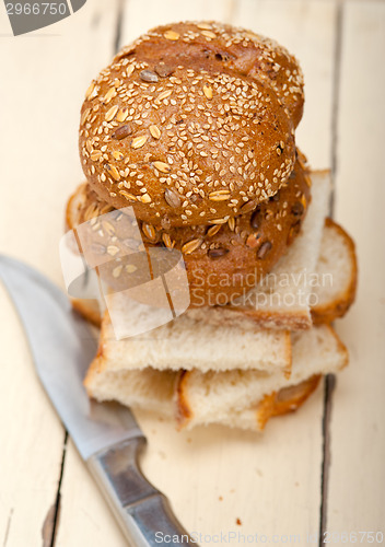 Image of organic bread over rustic table