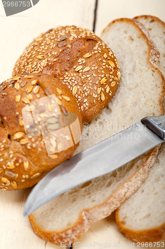Image of organic bread over rustic table