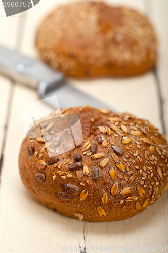 Image of organic bread over rustic table