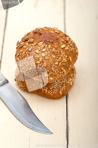 Image of organic bread over rustic table