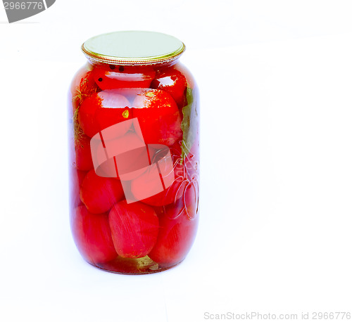Image of Canned tomatoes in a large glass jar on white background