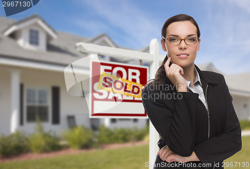 Image of Mixed Race Woman in Front of House and Sold Sign