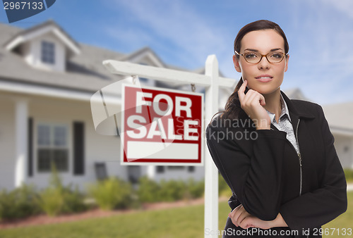 Image of Young Woman in Front of House and Sale Sign