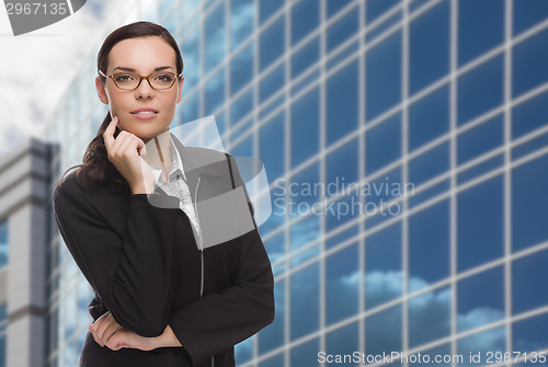 Image of Confident Attractive Mixed Race Woman in Front of Corporate Buil