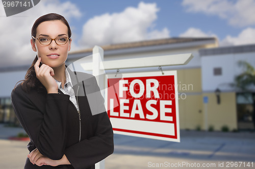 Image of Woman In Front of Commercial Building and For Lease Sign