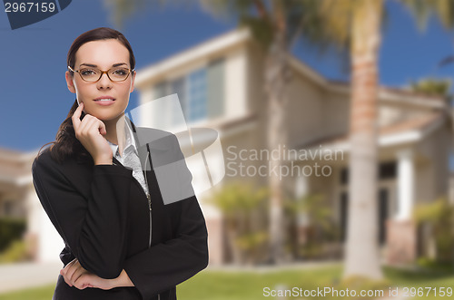 Image of Mixed Race Woman in Front of Residential House