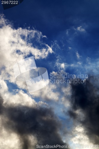 Image of Blue sky with sunlight storm clouds