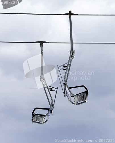 Image of Chair-lifts and overcast sky