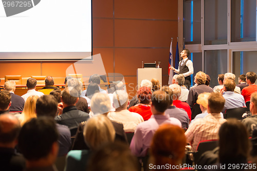 Image of Speaker at Business Conference and Presentation.