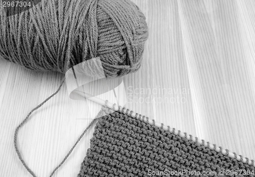 Image of Ball of wool with knitting on the needle