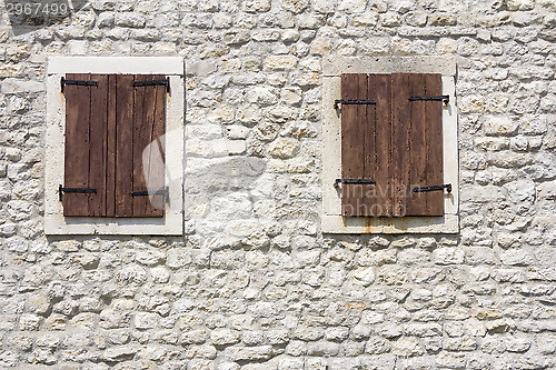 Image of Windows in the old stone wall
