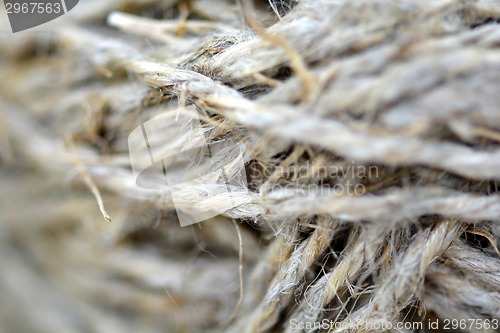 Image of Close-up of an old frayed boat rope as a nautical background. Sepia