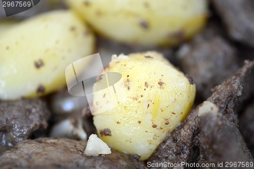 Image of Mixed grill on a plate, meat and potatoes