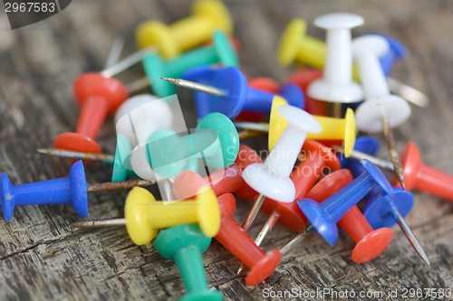 Image of Set of old pins on wood background