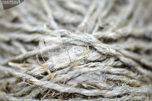 Image of Close-up of an old frayed boat rope as a nautical background. Sepia