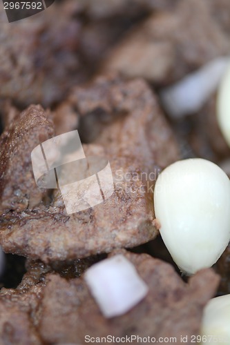 Image of macro food, meat and garlic