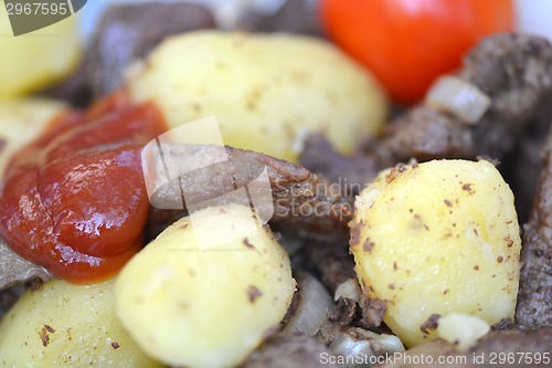 Image of Fried pork liver with tomatoes and potatoes