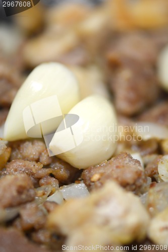 Image of macro food, garlic on fried liver