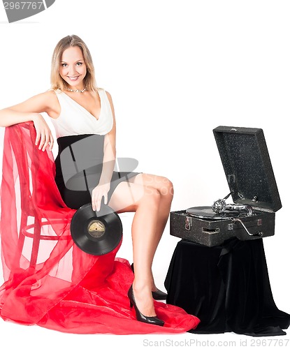 Image of Pretty blonde woman with gramophone
