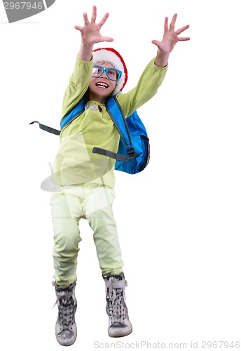 Image of happy Christmas schoolgirl or traveler exercising, running and jumping