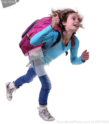 Image of happy schoolgirl or traveler exercising and jumping