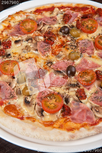 Image of pizza with ham and mushrooms