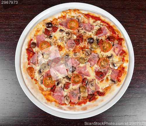 Image of pizza with ham and mushrooms