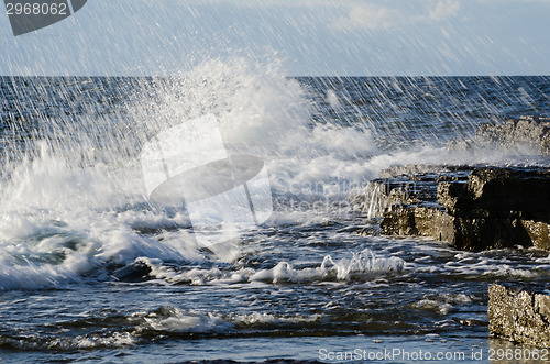 Image of Splashing water at rocky coast