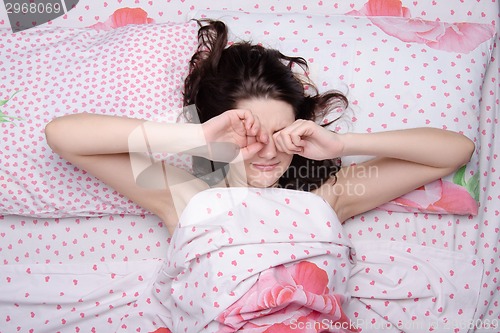 Image of The girl woke up rubbing his eyes