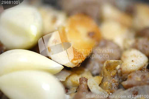 Image of macro food, garlic on fried liver