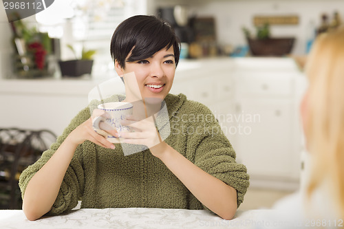 Image of Mixed Race Young Attractive Woman Socializing with Friend