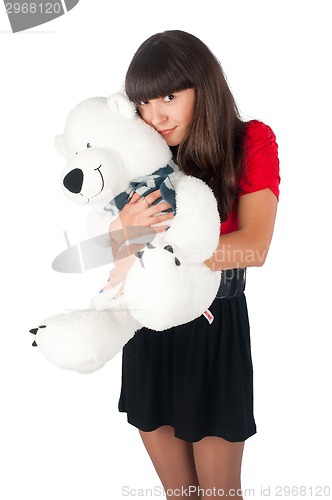 Image of Pretty girl with bear toy