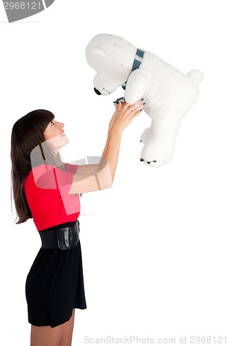 Image of Pretty girl with bear toy