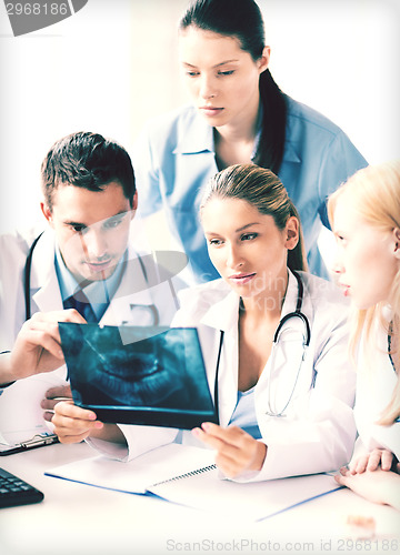 Image of young group of doctors looking at x-ray