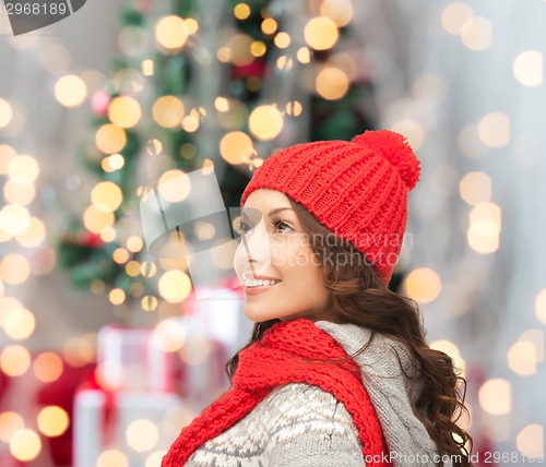 Image of smiling young woman in winter clothes