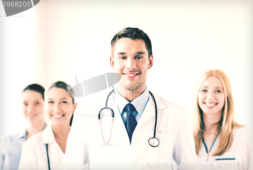 Image of male doctor in front of medical group