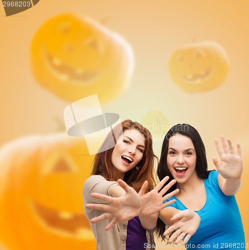 Image of smiling teenage girls having fun