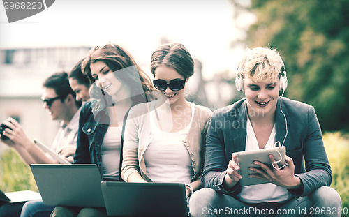 Image of students or teenagers with laptop computers