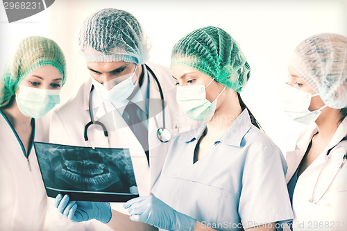 Image of young group of doctors looking at x-ray