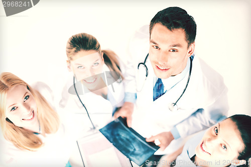 Image of young group of doctors looking at x-ray