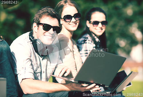 Image of students or teenagers with laptop computers