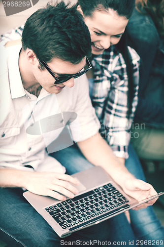 Image of students or teenagers with laptop computer