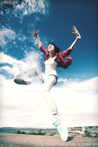 Image of beautiful dancing girl jumping